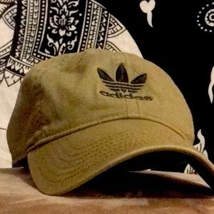 Adidas green and black hat that is meant for anybody. Good shape,good quality.